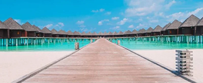 Maldives — overwater villas on a coral atoll